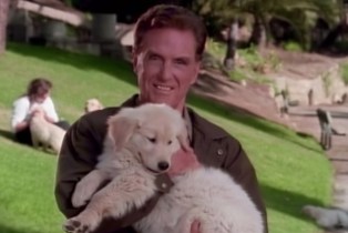 Robert Stack holding a puppy